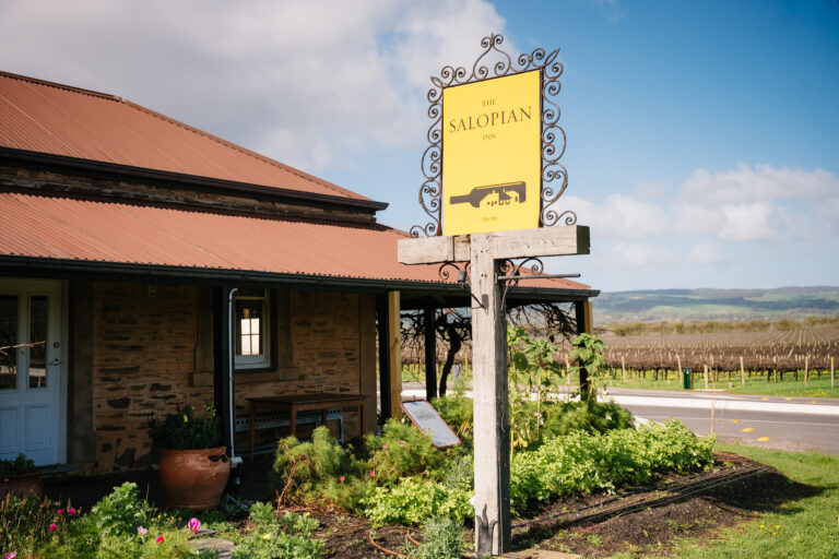 The Salopian Inn sign and vineyards — photograph by Meaghan Coles