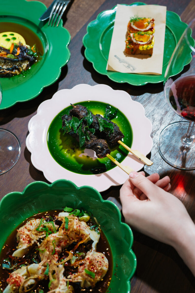 Shared dishes and wine — photograph by Meaghan Coles