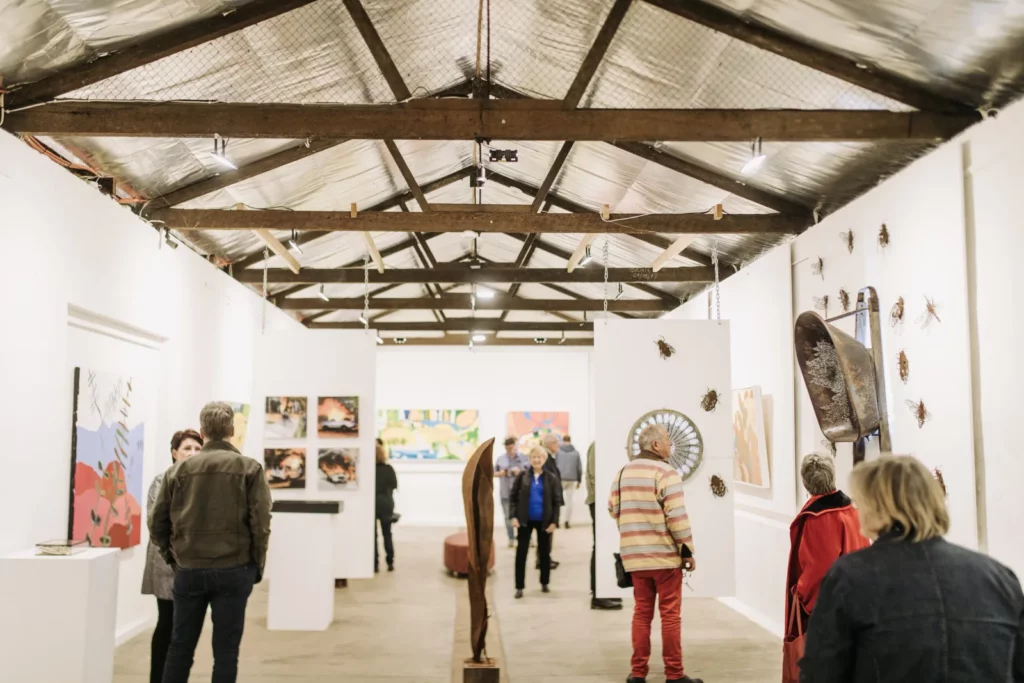 Visitors viewing art at Fleurieu Arthouse