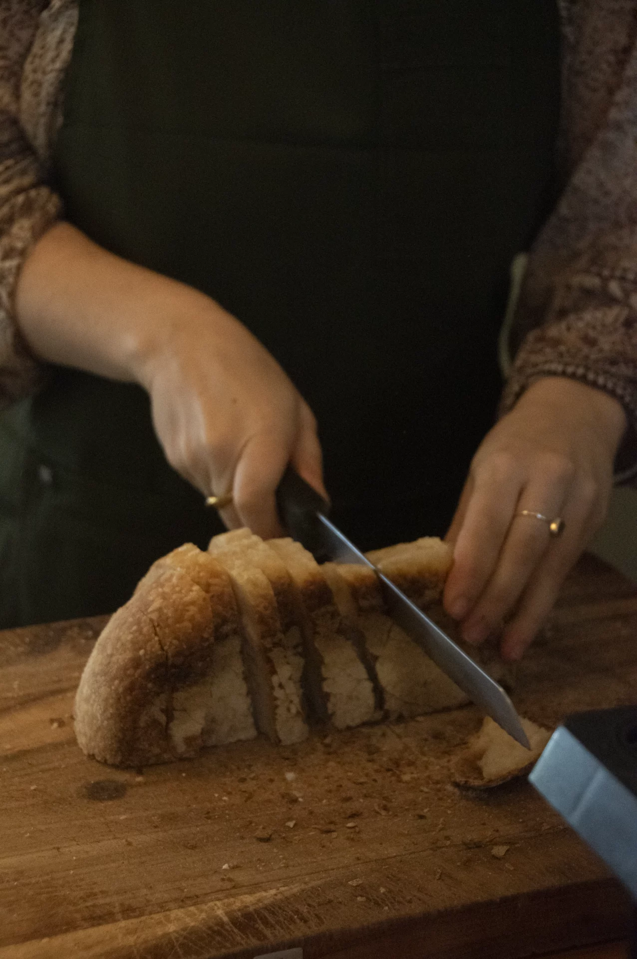 Sourdough bread being sliced in the Salopian Inn kitchen