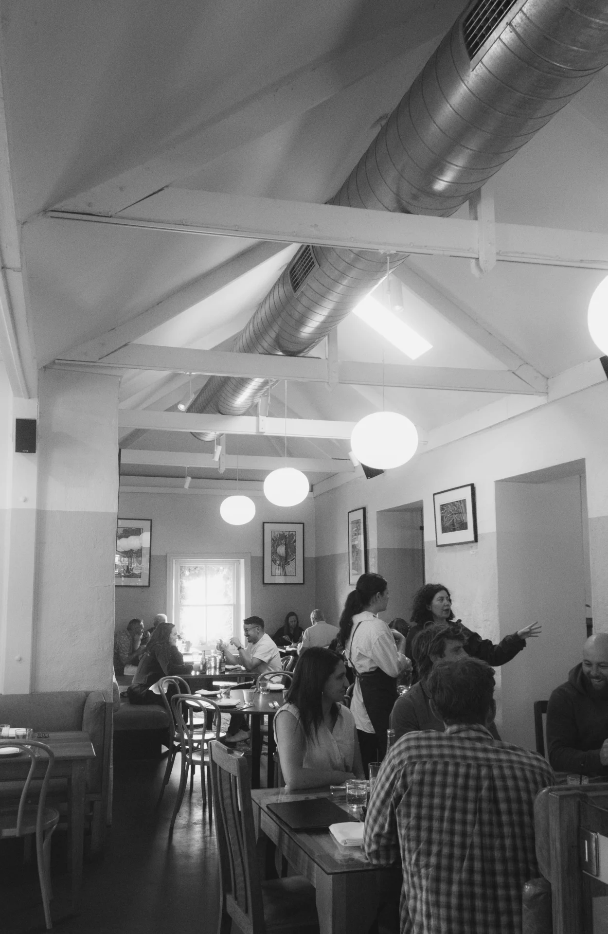 Guests sharing meals and conversation in the Salopian Inn dining room